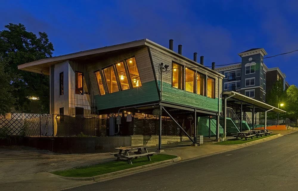 Franklin Barbecue building at night with warm, glowing windows